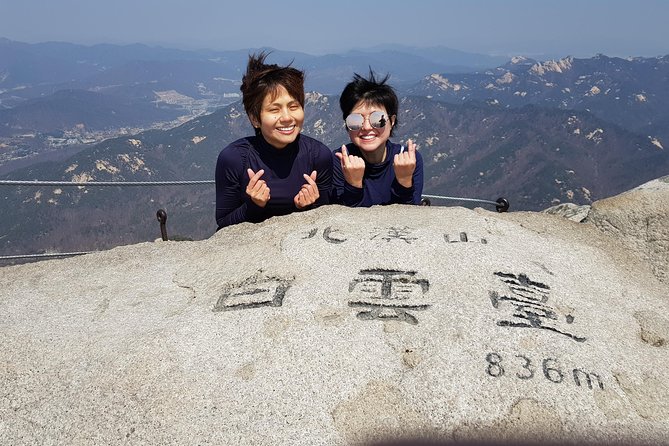 Hike and Explore the Wonder of Bukhansan National Park with hiking professional(including Lunch) - Descending through valleys to a Buddhist temple