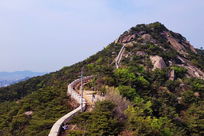 Inwangsan hike & historical sites - The summit view: N Seoul Tower, Lotte Tower, and the city below