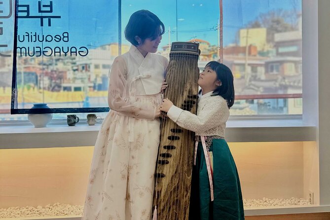 Play Gayageum in Hanbok Cultural Experience in Bukchon - Playing gayageum near Gyeongbokgung