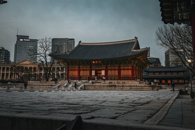 Seoul History Tour: Dark Past & Market Street Flavors - Deoksugung Palace beside the modern city